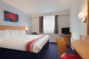 Postel nebo postele na pokoji v ubytování Ramada Wakefield