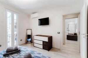 Ένα ή περισσότερα κρεβάτια σε δωμάτιο στο Como Lake 5minuti da Como Centro