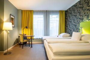 Katil atau katil-katil dalam bilik di Thon Hotel EU