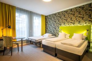 Katil atau katil-katil dalam bilik di Thon Hotel EU
