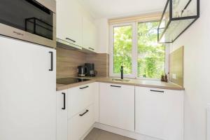 Η κουζίνα ή μικρή κουζίνα στο Bungalow Jonkerstee 207 +3 φωτογραφίες