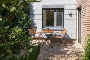 Κήπος έξω από το modernes Apartment mit Terrasse