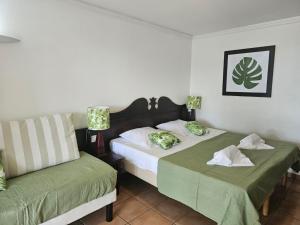 Postel nebo postele na pokoji v ubytování Le Flora, 2 chambres, vue mer