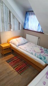 Postel nebo postele na pokoji v ubytování Hotel Kormoran