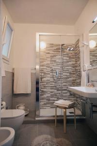 a bathroom with a shower and a toilet and a sink at Il Nettare in Riomaggiore