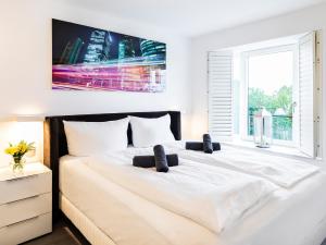 Ein Bett oder Betten in einem Zimmer der Unterkunft FeWo Prora - GiGi