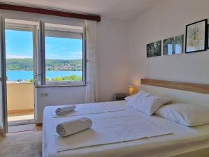 Postel nebo postele na pokoji v ubytování Apartments Citkovic