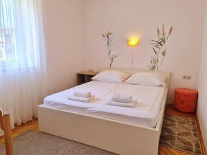 Postel nebo postele na pokoji v ubytování Apartments Citkovic