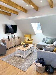 Μια τηλεόραση ή/και κέντρο ψυχαγωγίας στο Harz Apartment 'Storchennest' mit Seeblick - Bubo am See