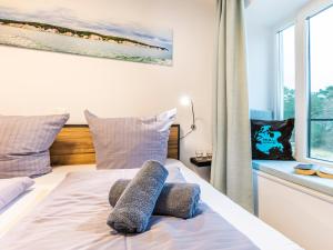 Ein Bett oder Betten in einem Zimmer der Unterkunft FeWo Prora - PRORA week