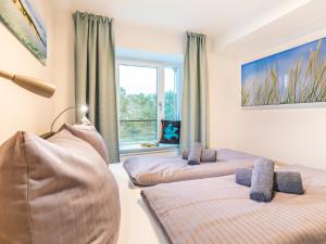 Ein Bett oder Betten in einem Zimmer der Unterkunft FeWo Prora - PRORA week