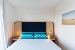 Кровать или кровати в номере Grand Hotel Flora
