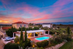an aerial view of a house with a swimming pool at Villa Almond in Nin