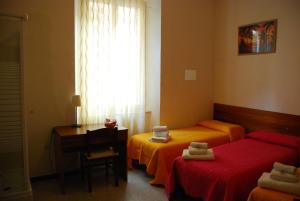 A bed or beds in a room at Affittacamere Euro