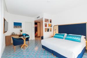 Кровать или кровати в номере Grand Hotel Flora