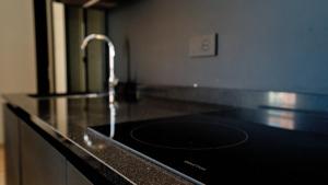a kitchen counter with a sink with a faucet at Relais Santa Lucia - Appartamenti Superior e Deluxe in Vicenza