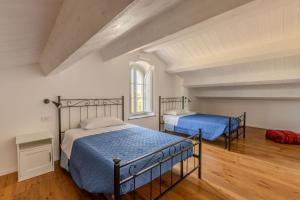 a bedroom with two beds in a room at Villa Margherita in Francavilla dʼEte +40 photos