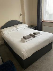 Postel nebo postele na pokoji v ubytování Merlewood Hotel