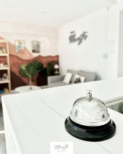 a silver dish sitting on top of a counter at Hotel Musto in Rosario