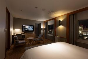 Postel nebo postele na pokoji v ubytování ANA Crowne Plaza Sapporo by IHG