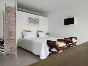 Ένα ή περισσότερα κρεβάτια σε δωμάτιο στο La Finca de Ananás - Suite privada con entrada independiente