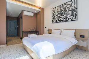 Postel nebo postele na pokoji v ubytování Anoor Studios & Apartments in Gemmayze