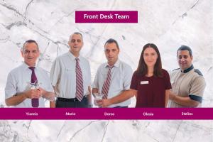 a group of people wearing ties posing for a picture at Crowne Plaza Limassol by IHG in Limassol
