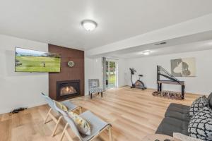 a living room with a couch and a fireplace at Parkside Escape Oasis in Bellevue fully fenced in Bellevue