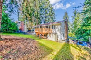 a house with a porch and a deck at Parkside Escape Oasis in Bellevue fully fenced in Bellevue