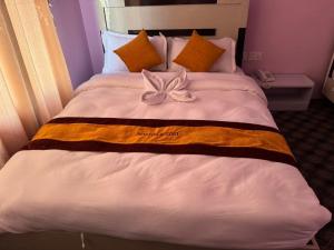 Postel nebo postele na pokoji v ubytování Amazon Resort