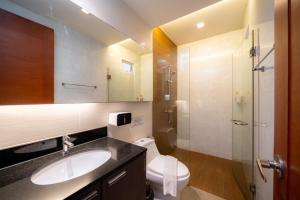 a bathroom with a sink and a toilet and a shower at Cazy pool villa pattaya in Jomtien Beach +65 photos