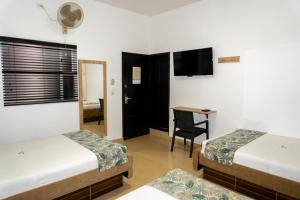 Postel nebo postele na pokoji v ubytování Hotel Central Plaza Medellin