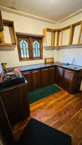 Kuchyň nebo kuchyňský kout v ubytování Nuwara Eliya Holiday Home