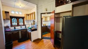 Kuchyň nebo kuchyňský kout v ubytování Nuwara Eliya Holiday Home