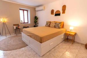 Postel nebo postele na pokoji v ubytování Samora Guest House