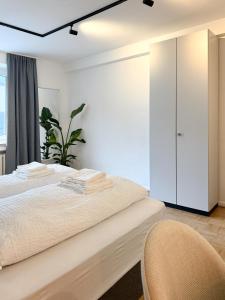 Postel nebo postele na pokoji v ubytování Moderne City-Wohnung mit Self Check-In und Free Wifi im Zentrum