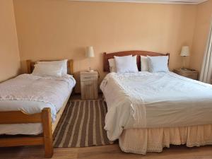 Postel nebo postele na pokoji v ubytování Hostal Los Almendros