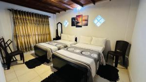 Postel nebo postele na pokoji v ubytování Nuwara Eliya Holiday Home