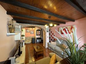 a living room with a couch and a table at Casa Las Hortensias 1 Pendueles AT-1557-AS in Llanes