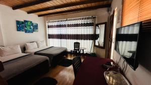 Postel nebo postele na pokoji v ubytování Nuwara Eliya Holiday Home