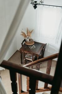 a table and chairs in a room with a window at Astrio Suites in Livadi