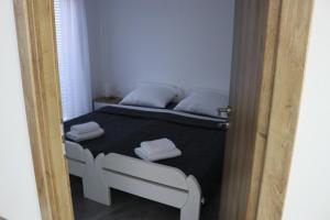 Postel nebo postele na pokoji v ubytování Guest House Neno