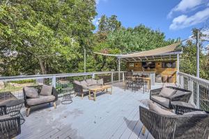 a deck with chairs and a table and a grill at Authentic Austin Pad with Roof-top Deck Bar in Austin