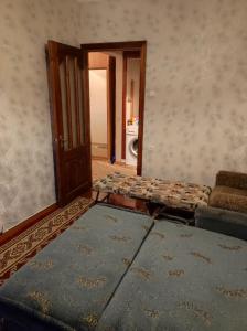 a room with a door and a table and a laundry room at Apartament cu toate condițiile in Orhei +8 photos