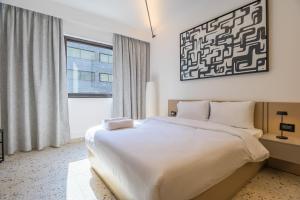 Postel nebo postele na pokoji v ubytování Anoor Studios & Apartments in Gemmayze