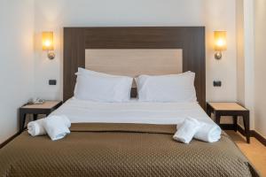 Voodi või voodid majutusasutuse NSM Hotel Palace Lucera toas