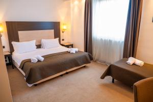 Voodi või voodid majutusasutuse NSM Hotel Palace Lucera toas