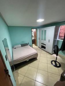 En eller flere senge i et værelse på Casa da paz