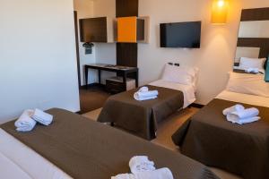 Voodi või voodid majutusasutuse NSM Hotel Palace Lucera toas