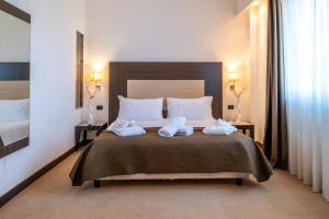 Voodi või voodid majutusasutuse NSM Hotel Palace Lucera toas